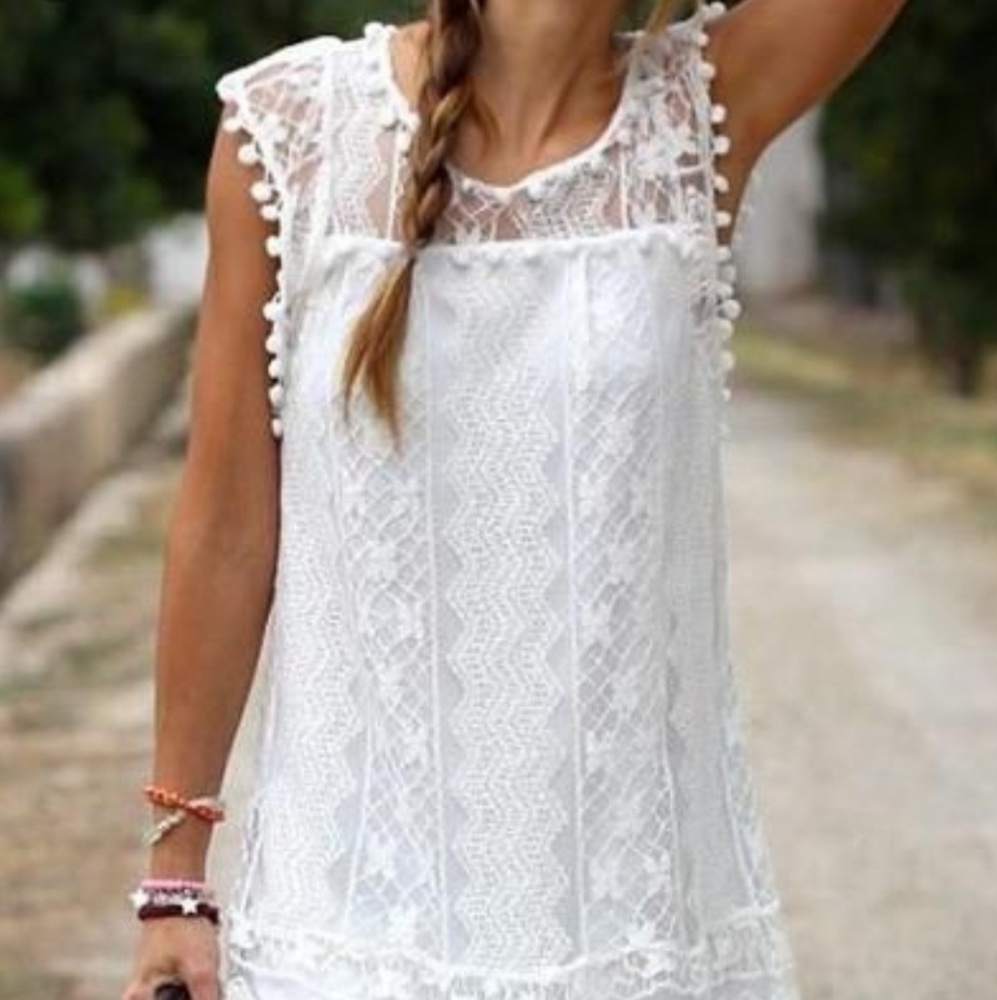 White lace dress with pom pom trim